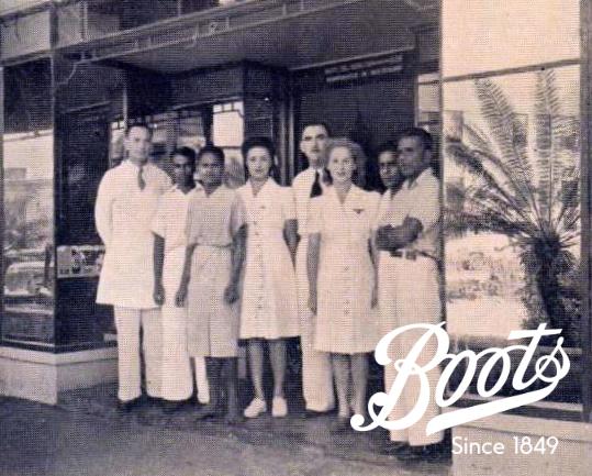 Boots in Fiji 3 Boots employees pictured in front of the Fiji store (The Triangle, Suva), c1945.