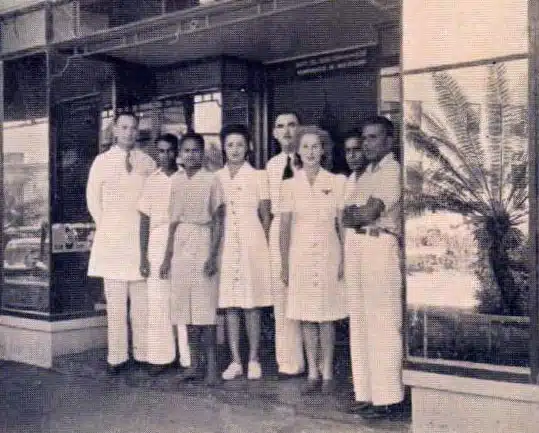 Boots employees pictured in front of the Fiji store (The Triangle, Suva), c1945.