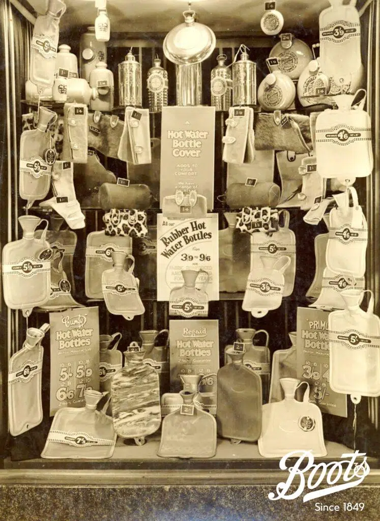 Boots hot water bottles store window display, c1930.