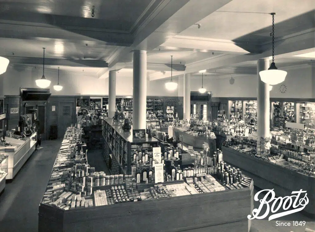 The interior layout of the Boots store in Union Street Bath, c1950. The large counters dominated the sales floor and staff would serve customers from behind the kiosk space. The open-display trays are visible around the perimeter of the counter.